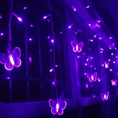 A Bunch Of Purple Lights With The Words `` Goodbye '' Written On It . GIF