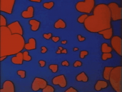 A Bunch Of Red Hearts Are Floating In The Air On A Blue Background GIF
