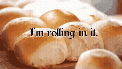 A Bunch Of Rolls With The Words I 'M Rolling In It On Them GIF