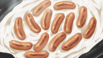 A Bunch Of Sausages Are Cooking In A Pan GIF