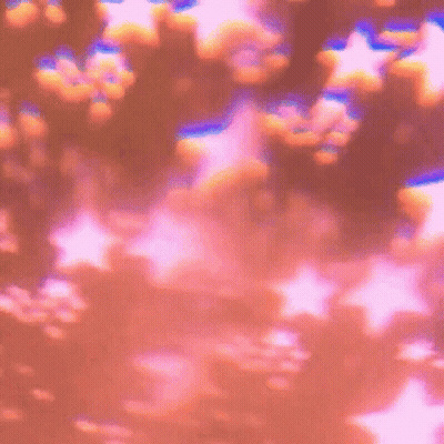 A Bunch Of Stars Are Floating In The Air On A Pink Background GIF