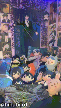 A Bunch Of Stuffed Animals Are Laying On A Bed In Front Of A Wall That Says Nsaw M GIF