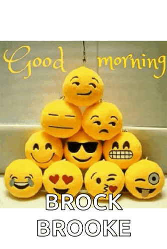 A Bunch Of Stuffed Smiley Faces Are Stacked On Top Of Each Other With The Words `` Good Morning Brock Brooke '' GIF