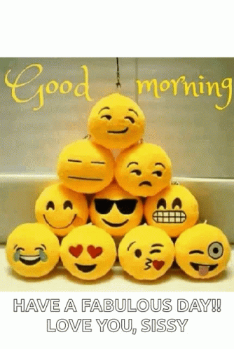 A Bunch Of Stuffed Smiley Faces Are Stacked On Top Of Each Other With The Words `` Have A Fabulous Day ! `` GIF