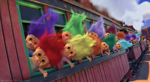 A Bunch Of Trolls Are Looking Out Of A Window GIF