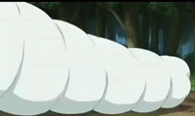 A Bunch Of White Balls Are Floating In The Air In A Cartoon . GIF