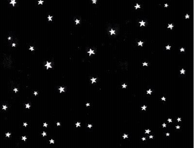 A Bunch Of White Stars Are Falling In The Night Sky On A Black Background . GIF