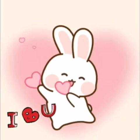 A Bunny Holding A Heart With The Words I Love You GIF
