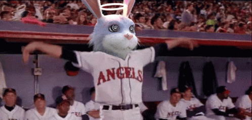 A Bunny Wearing A Angels Jersey Stands In Front Of A Crowd GIF