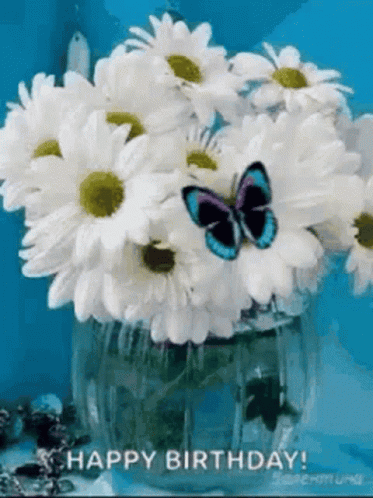 A Butterfly Is Flying Over A Vase Of Daisies With The Words Happy Birthday Written On The Bottom GIF