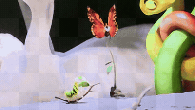 A Butterfly Is Sitting On A Plant While A Caterpillar Is Crawling On The Ground GIF