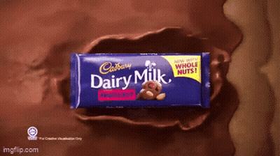 A Cadbury Dairy Milk Bar With A Teddy Bear On The Front GIF