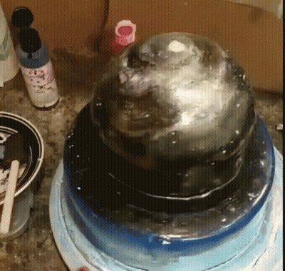 A Cake Is Sitting On Top Of A Blue Plate GIF