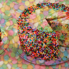 A Cake With A Slice Taken Out Of It And Sprinkles On Top GIF