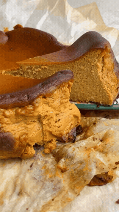 A Cake With A Slice Taken Out Of It On A Plate GIF