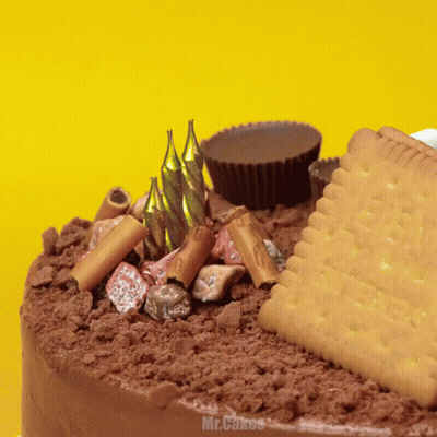 A Cake With Candles And A Cookie That Says Butter GIF