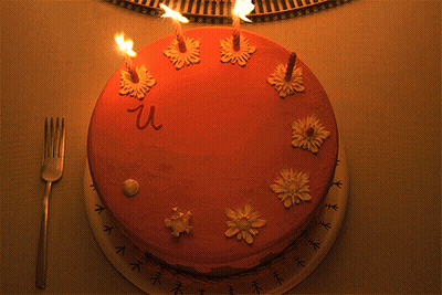 A Cake With Candles On It And The Word We Written On It GIF
