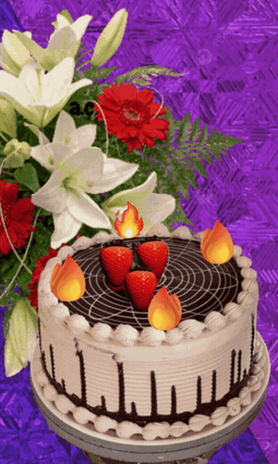 A Cake With Strawberries And Candles On It GIF