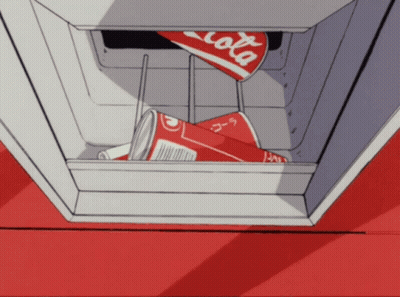 A Can Of Coca Cola Is Sitting In A Cooler GIF