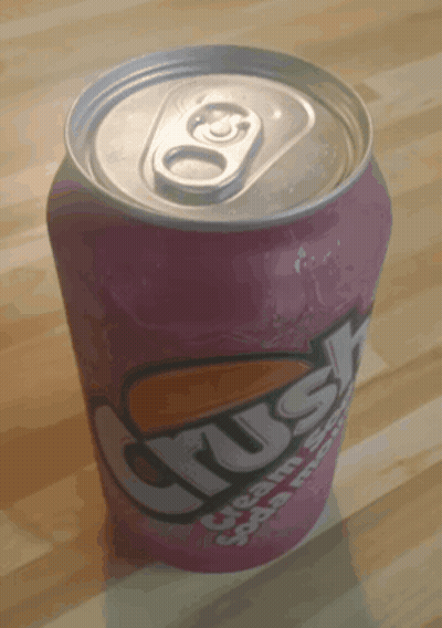 A Can Of Crush Cream Soda Sits On A Wooden Surface GIF