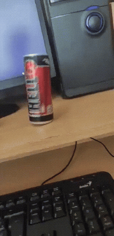 A Can Of Diet Coke Sits On A Desk Next To A Computer GIF