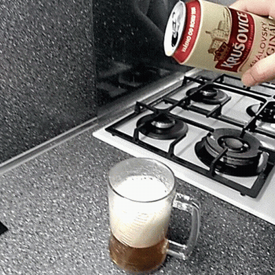 A Can Of Krusovice Is Poured Into A Glass GIF