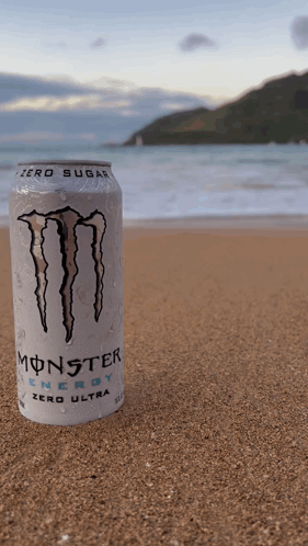 A Can Of Monster Energy Sits On The Beach GIF