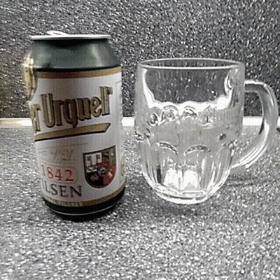A Can Of Pilsen Beer Sits Next To A Mug GIF