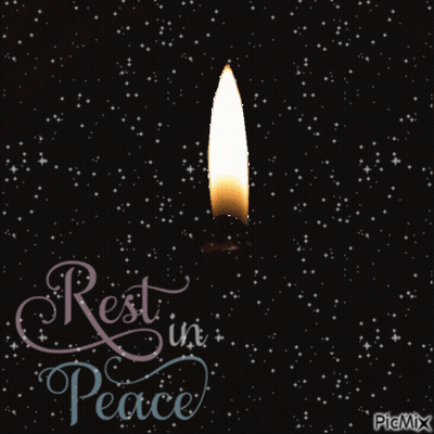 A Candle Is Lit Up In The Dark With The Words Rest In Peace Below It GIF
