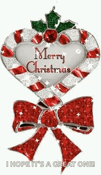 A Candy Cane In The Shape Of A Heart With A Bow And Holly On It . GIF
