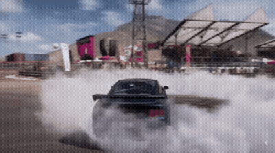 A Car Is Drifting In A Video Game And Smoke Is Coming Out Of It GIF