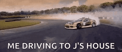 A Car Is Drifting On A Race Track With The Words `` Me Driving To J 'S House '' Written Above It . GIF