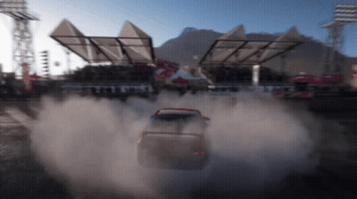 A Car Is Driving Down A Dirt Road With Smoke Coming Out Of It GIF