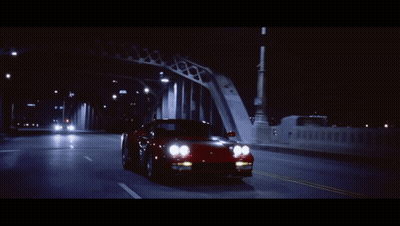 A Car Is Driving Down A Highway At Night And Has A License Plate That Says ' Lc ' On It GIF