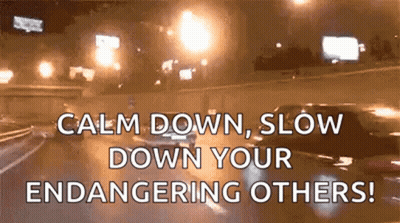 A Car Is Driving Down A Highway At Night And Says Calm Down Slow Down Your Endangering Others . GIF