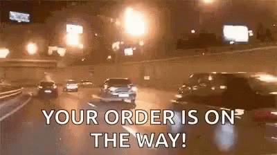 A Car Is Driving Down A Highway At Night And Says `` Your Order Is On The Way ! '' GIF