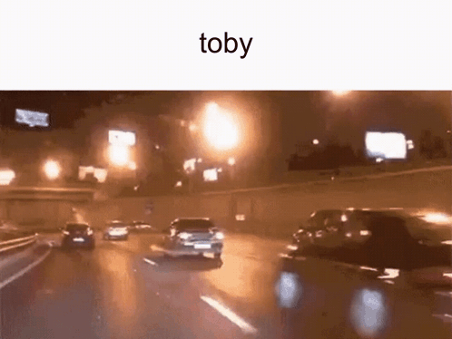 A Car Is Driving Down A Highway At Night With The Word Toby On The Bottom . GIF