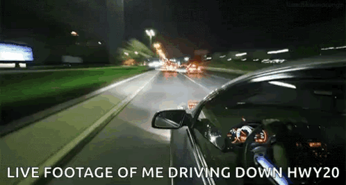 A Car Is Driving Down A Highway At Night With The Words Live Footage Of Me Driving Down Hwy20 Above It GIF