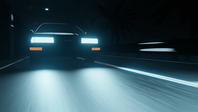 A Car Is Driving Down A Highway At Night GIF