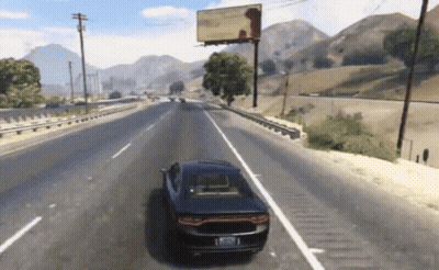 A Car Is Driving Down A Highway In Front Of A Billboard GIF