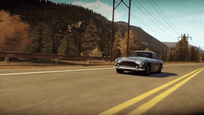A Car Is Driving Down A Highway With Mountains In The Background GIF