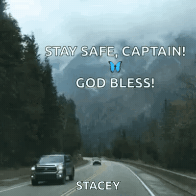 A Car Is Driving Down A Highway With Mountains In The Background And A Butterfly Flying In The Sky . GIF