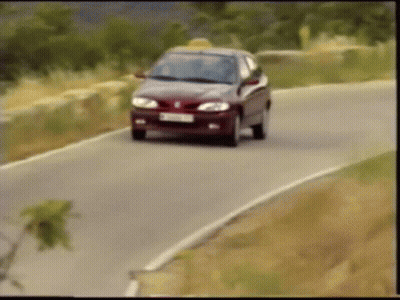 A Car Is Driving Down A Road With A License Plate That Says ' Tc ' On It GIF