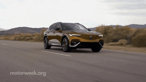 A Car Is Driving Down A Road With A Motorweek.org Logo In The Corner GIF