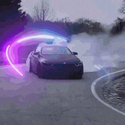 A Car Is Driving Down A Road With A Purple Light Behind It GIF