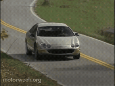 A Car Is Driving Down A Road With Motorweek.org Written On The Bottom Of The Screen GIF