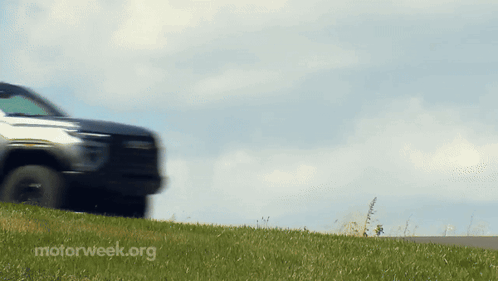 A Car Is Driving Down A Road With Motorweek.org Written On The Bottom Right GIF
