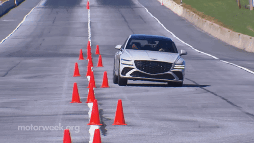 A Car Is Driving Down A Road With Motorweek.org Written On The Bottom Right GIF