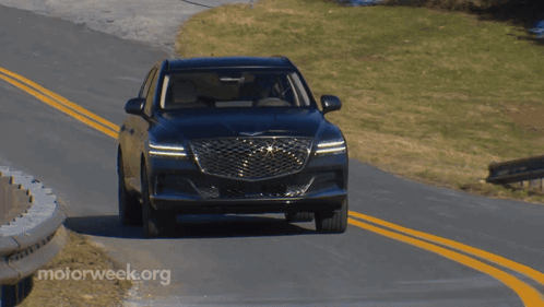 A Car Is Driving Down A Road With Motorweek.org Written On The Bottom Right GIF