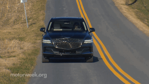 A Car Is Driving Down A Road With Motorweek.org Written On The Bottom Right GIF